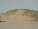 Desert on other side blows a river of sand.jpg